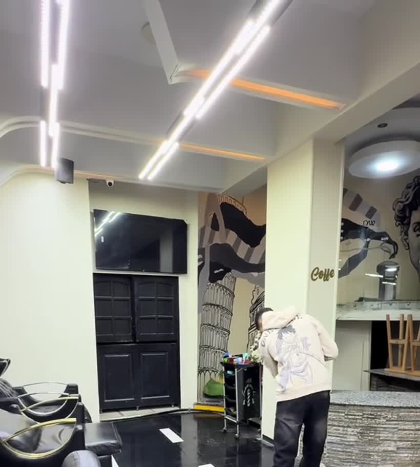 Wash stations and interior at RAMY Barbershop